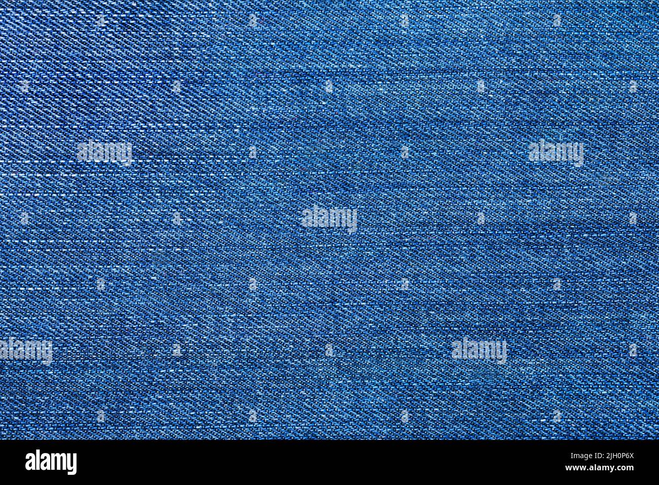 Detailed texture fabric denim background, Blue jeans. Dark blue tight denim background.Detailed