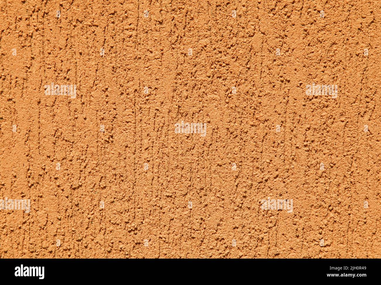 Orange wall, texture, background. Plastered building wall. Rough