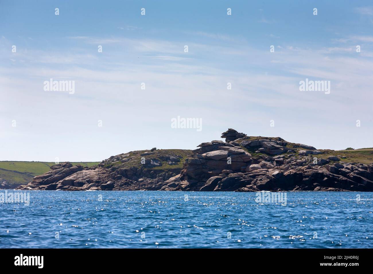 The carn at Giant's Castle on the Eastern shore of St. Mary's, Isles of Scilly, UK, from seaward Stock Photo