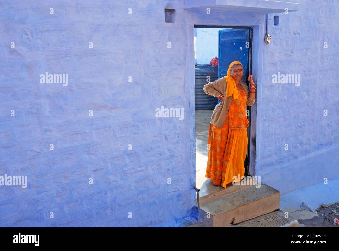 Judhpur People, Woman stand in her house doorstep, India Stock Photo