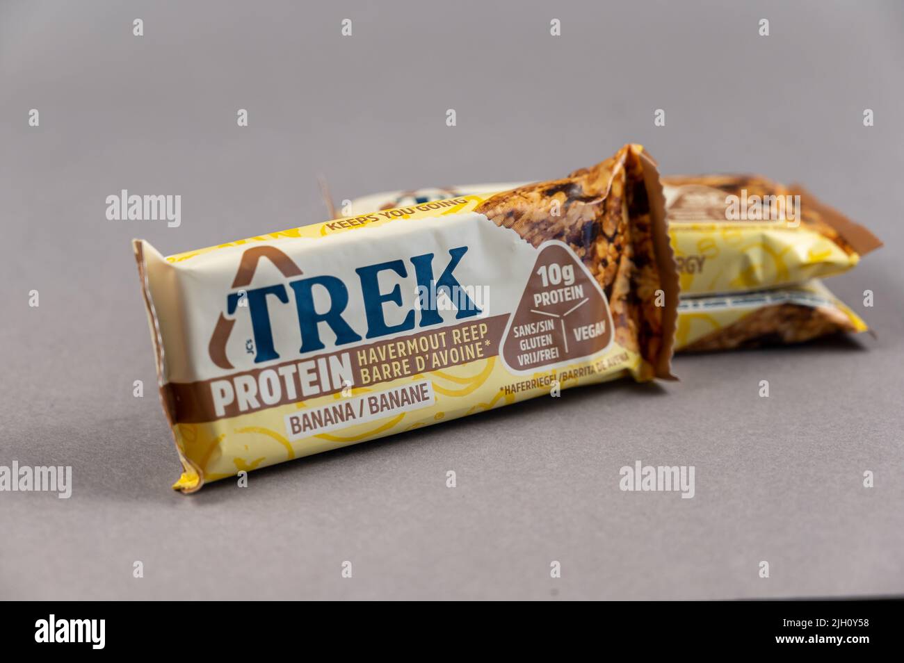 Three TREK Protein Energy Bars on Gray. A glutenfree, sugarfree snack
