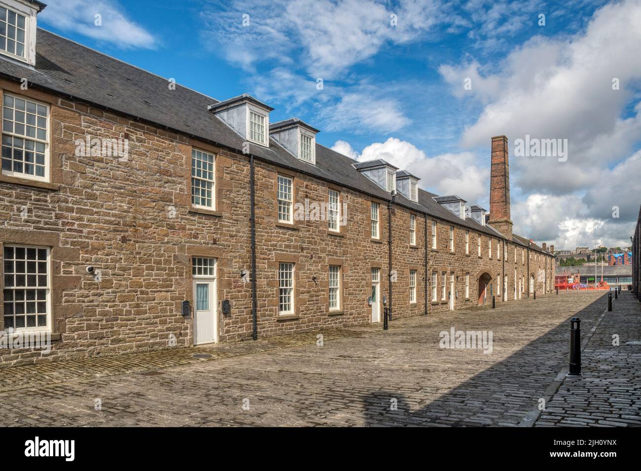Chandlers Lane, Dundee contains homes converted from the former harbour workshops dating back to 1837. The chimney marks the original blacksmiths. Stock Photo