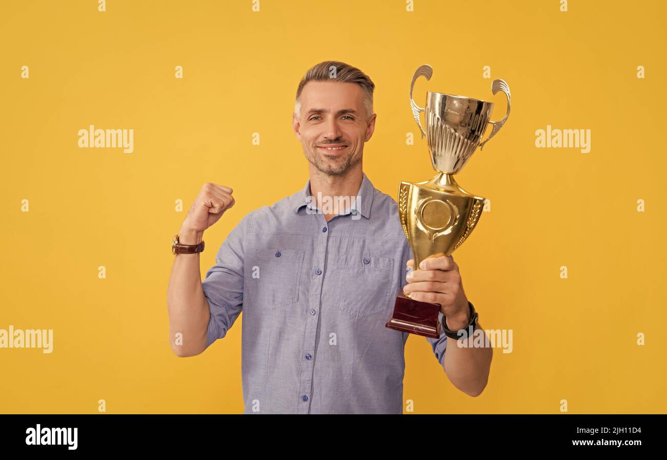 trophy and prestige. got prize. guy celebrate victory. inspiration and motivation. Stock Photo