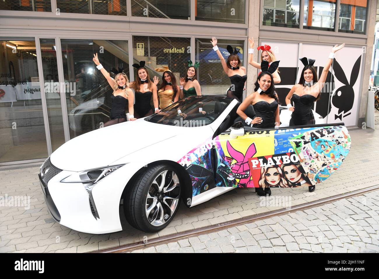 Munich, Germany. 13th July, 2022. Playboy bunnies show off on a car in front of the penthouse at Plant 12 at the '50 Years of Playboy Germany' anniversary party. Around 300 guests are expected at the anniversary celebration. Credit: Felix Hörhager/dpa/Alamy Live News Stock Photo