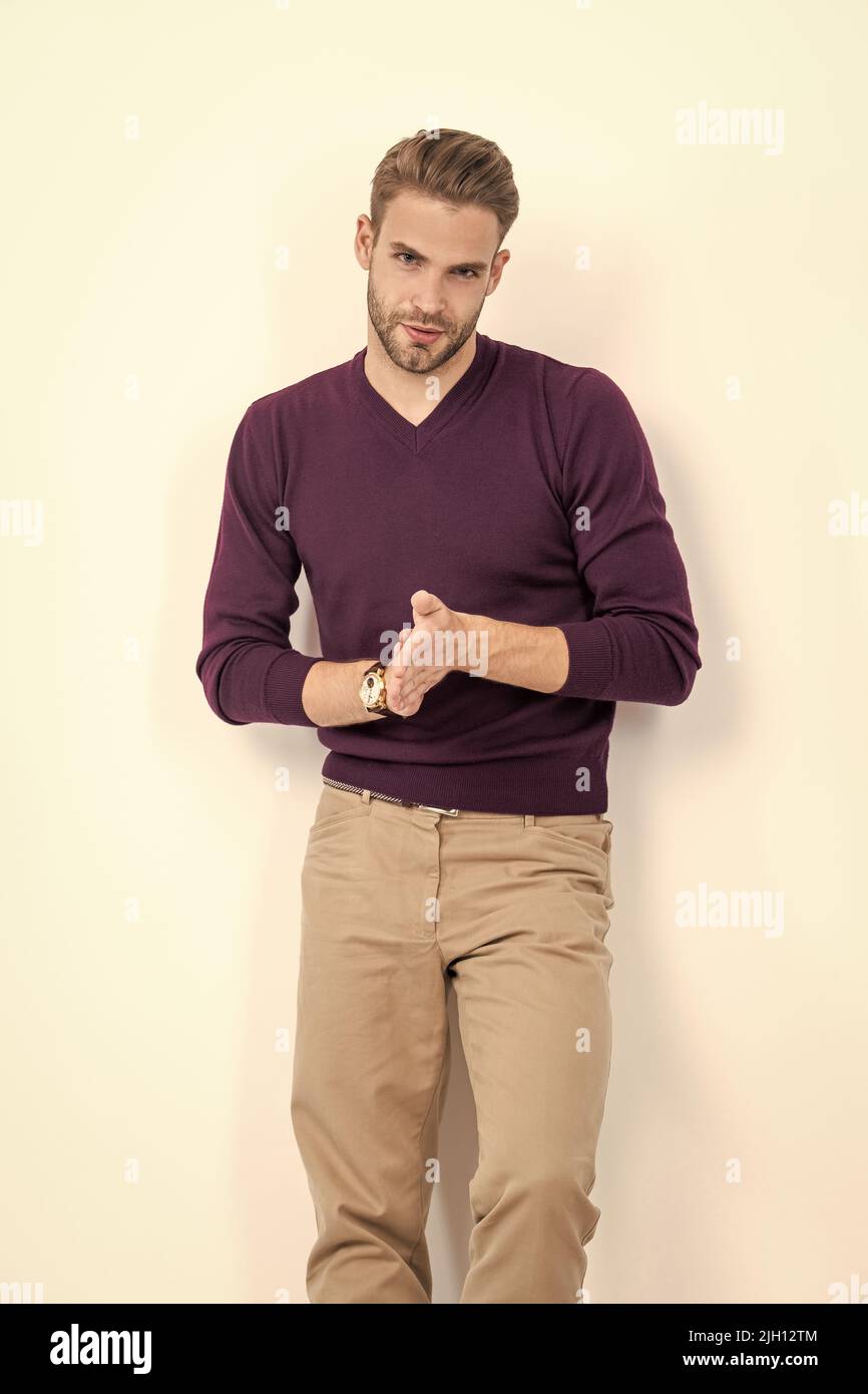 Mens wear. Handsome man wear pullover with pants. Casual outfit. Mens fashion. Trendy menswear Stock Photo