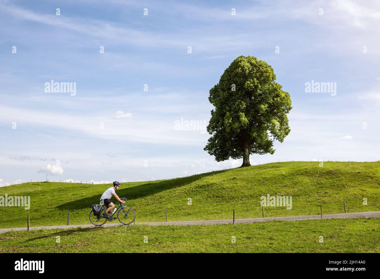 Person riding a bicycle hi-res stock photography and images - Alamy