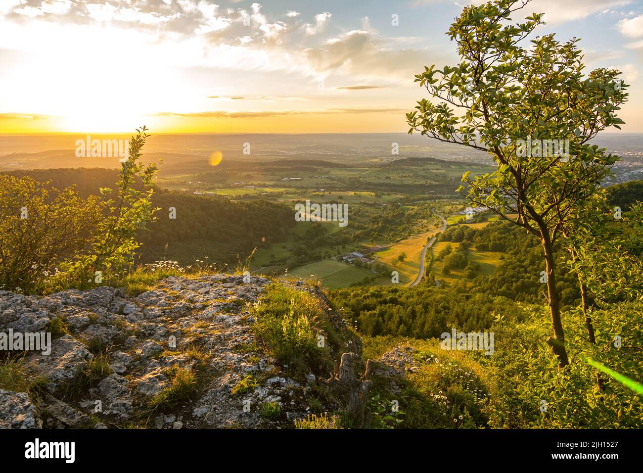 Dramatic sunset over scenic rock ledge in the Swabian Jura in Southern Germany Stock Photo
