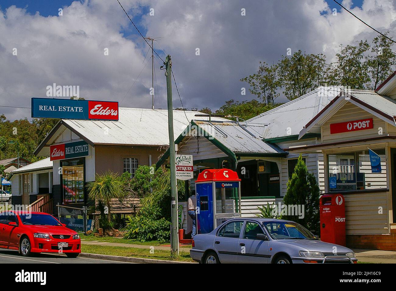 Main street of historic small town of Canungra, Queensland, Australia. Post office, phone box, estate agents, shops. Population 1300, plus tourists. Stock Photo