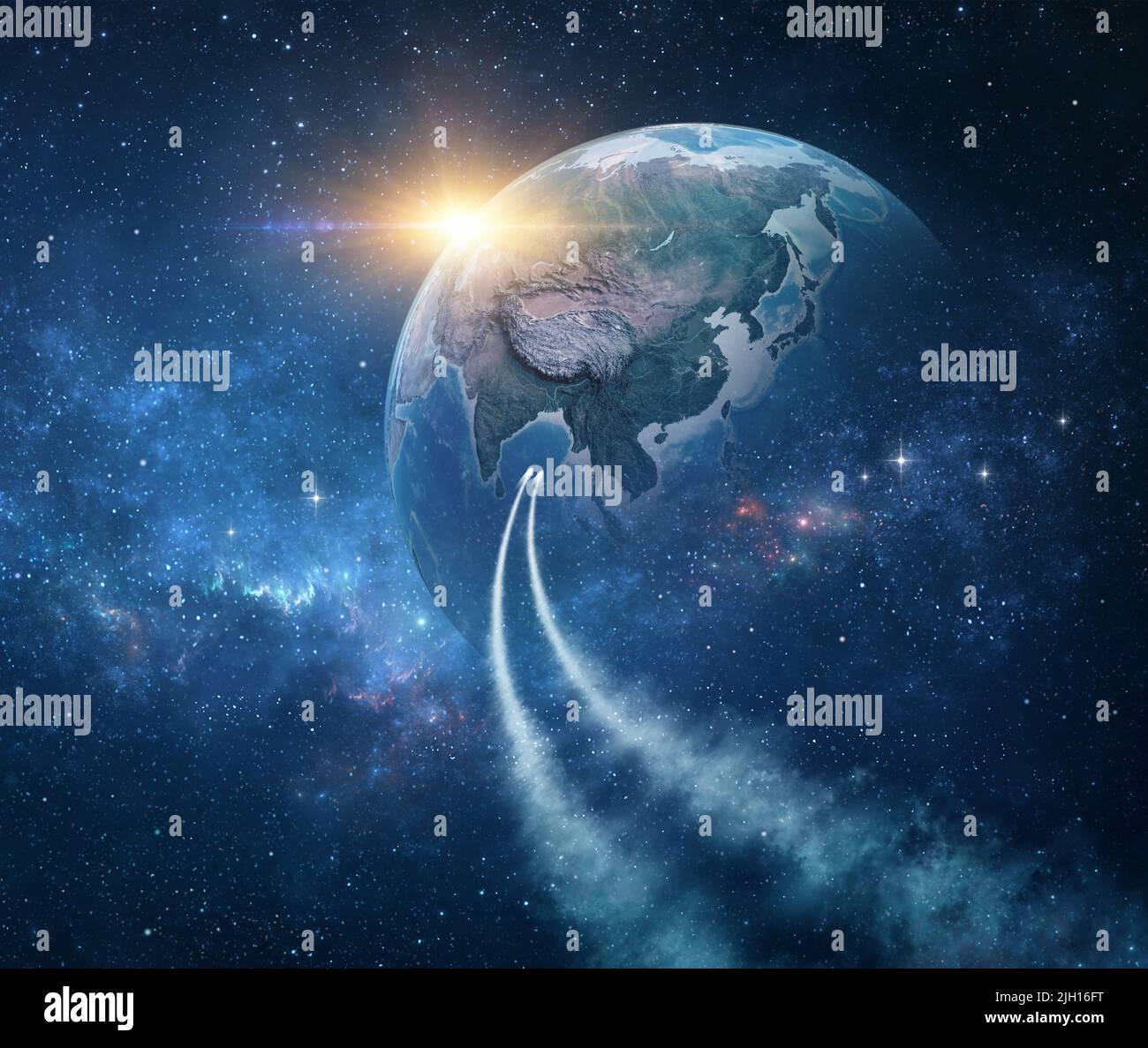 Spaceships, space probes traveling through galaxy, returning planet Earth, sun rising behind - Elements of this image furnished by NASA Stock Photo