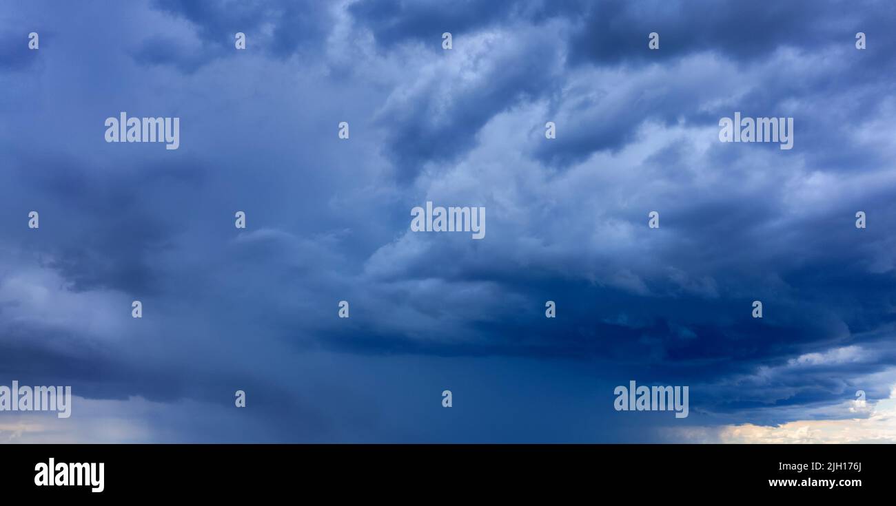 Light in the Dark and Dramatic Storm Clouds background Stock Photo - Alamy