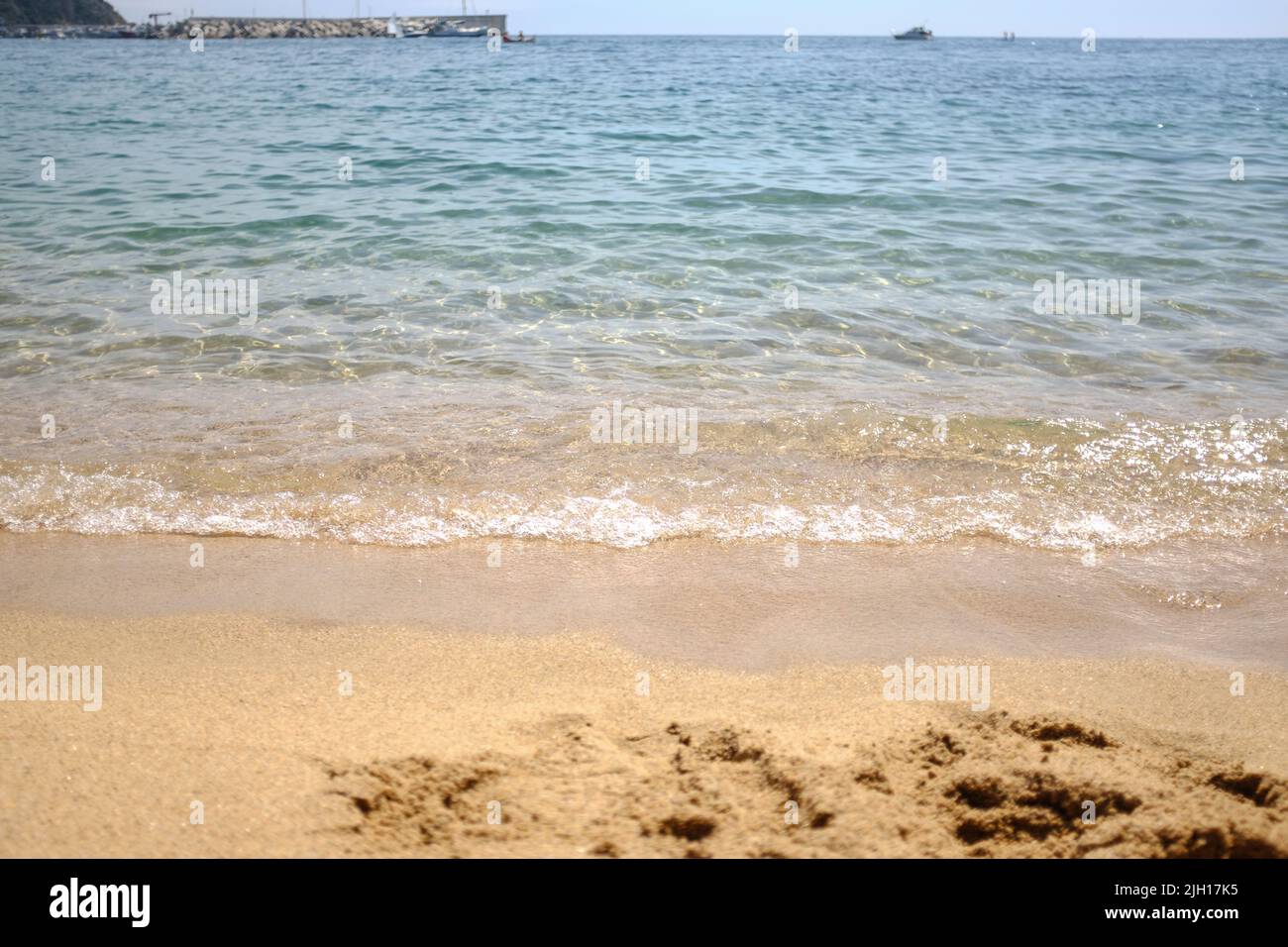 Sea quiet wave on a quiet scene in Mediterranean Beach in Catalonia Stock Photo