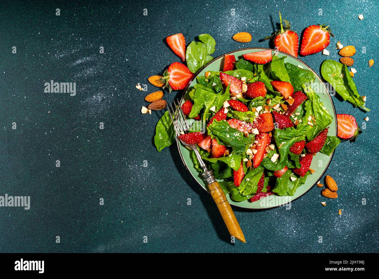 Strawberry, spinach and nuts salad. Healthy diet spring summer salad