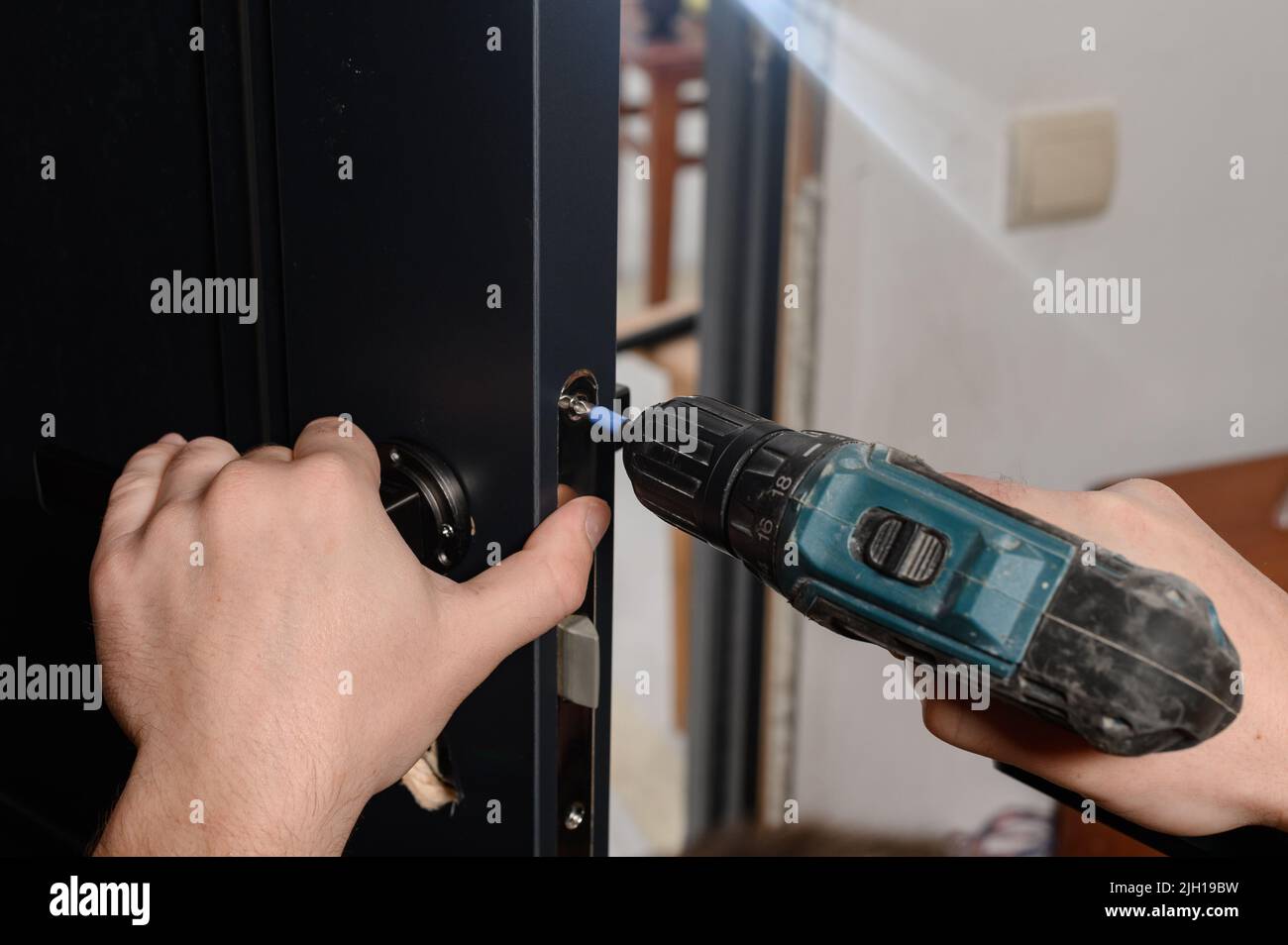 Installation of a door handle on interior doors, carpentry work with