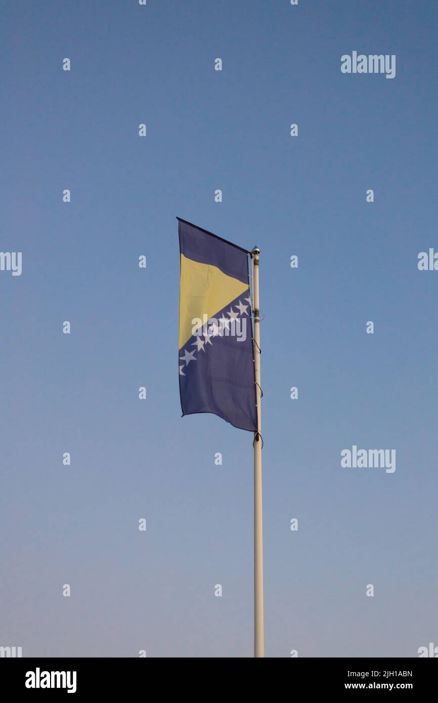 Blue sky background with bosnia and herzegovina flag hi-res stock ...
