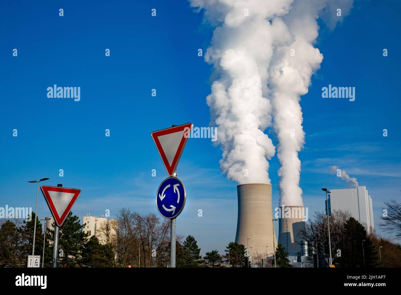 RWE Lignite-fired Power Plant Neurath In NRW. Coal-fired Power Plant With Traffic Signs Give Way And Traffic Circle In The Foreground. Stock Photo