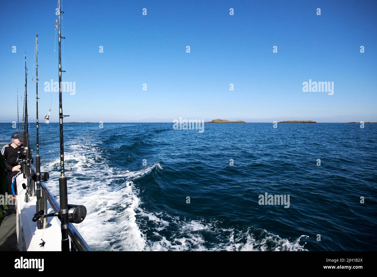 fishing rods on a charter angling boat at sea off the skerries portrush north coast northern ireland uk Stock Photo