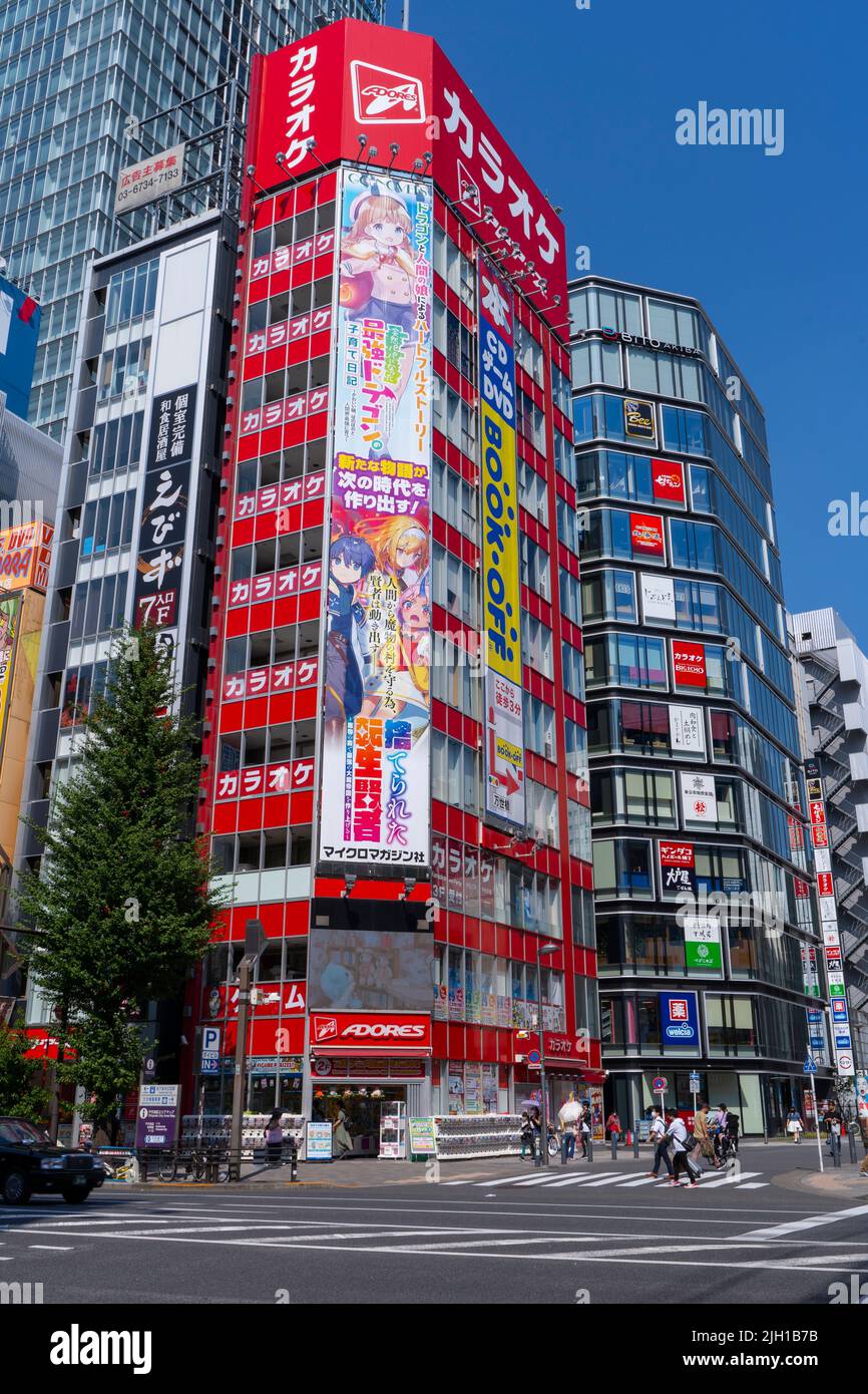 Akihabara, Japan August 14, 2020 People pass a building promoting activities in Akihabara