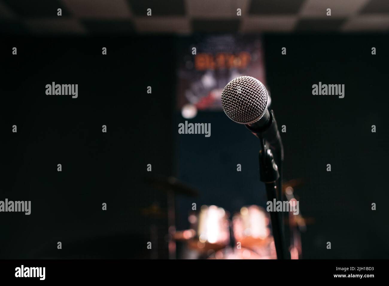 Microphone in music studio black background Stock Photo