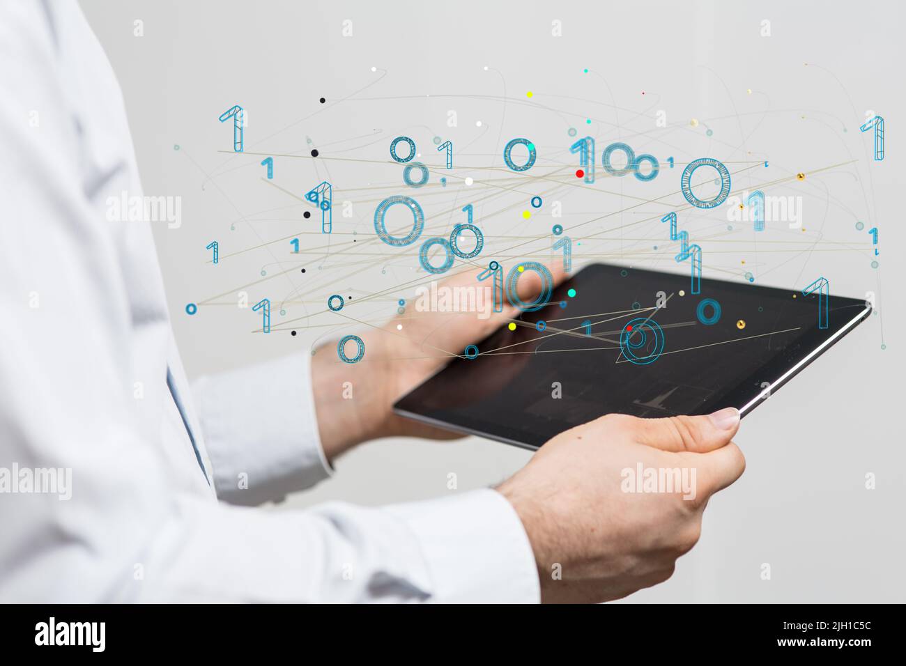 A person presenting a virtual projection of binary data Stock Photo