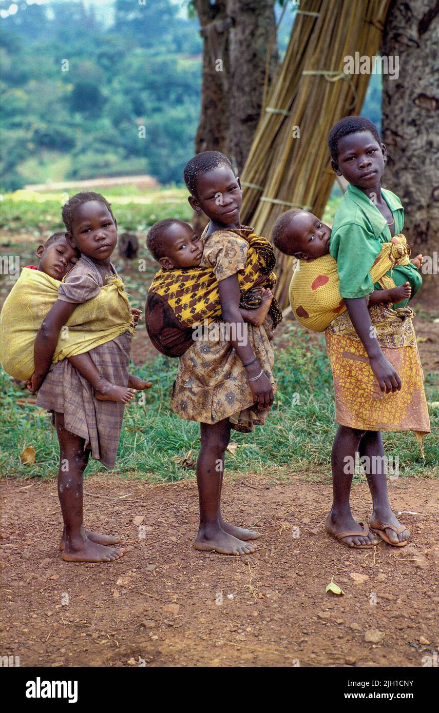 Uganda, Kampala; Children carrying babies on the back Stock Photo Alamy