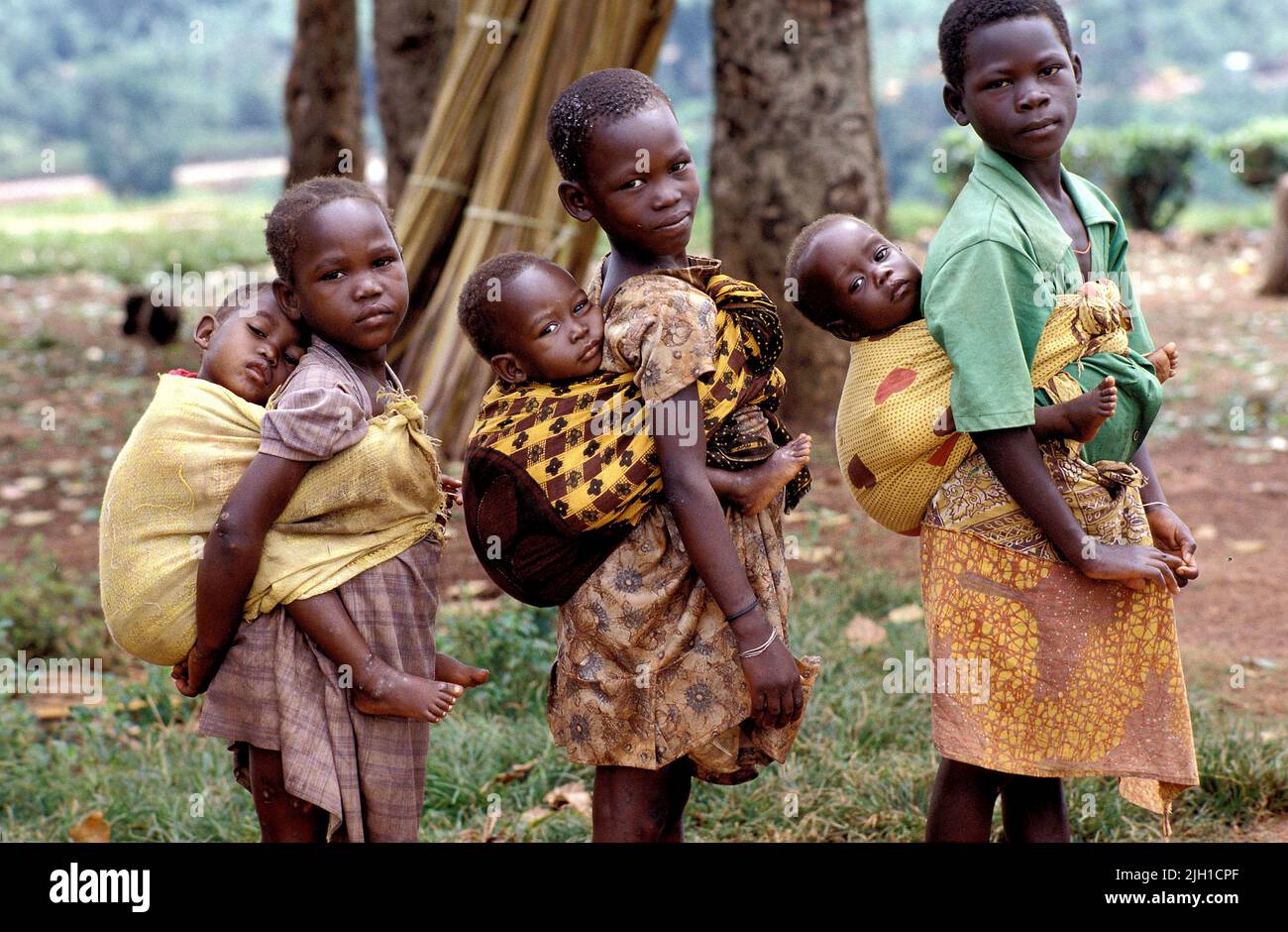 Uganda, Kampala; Children carrying babies on the back Stock Photo Alamy