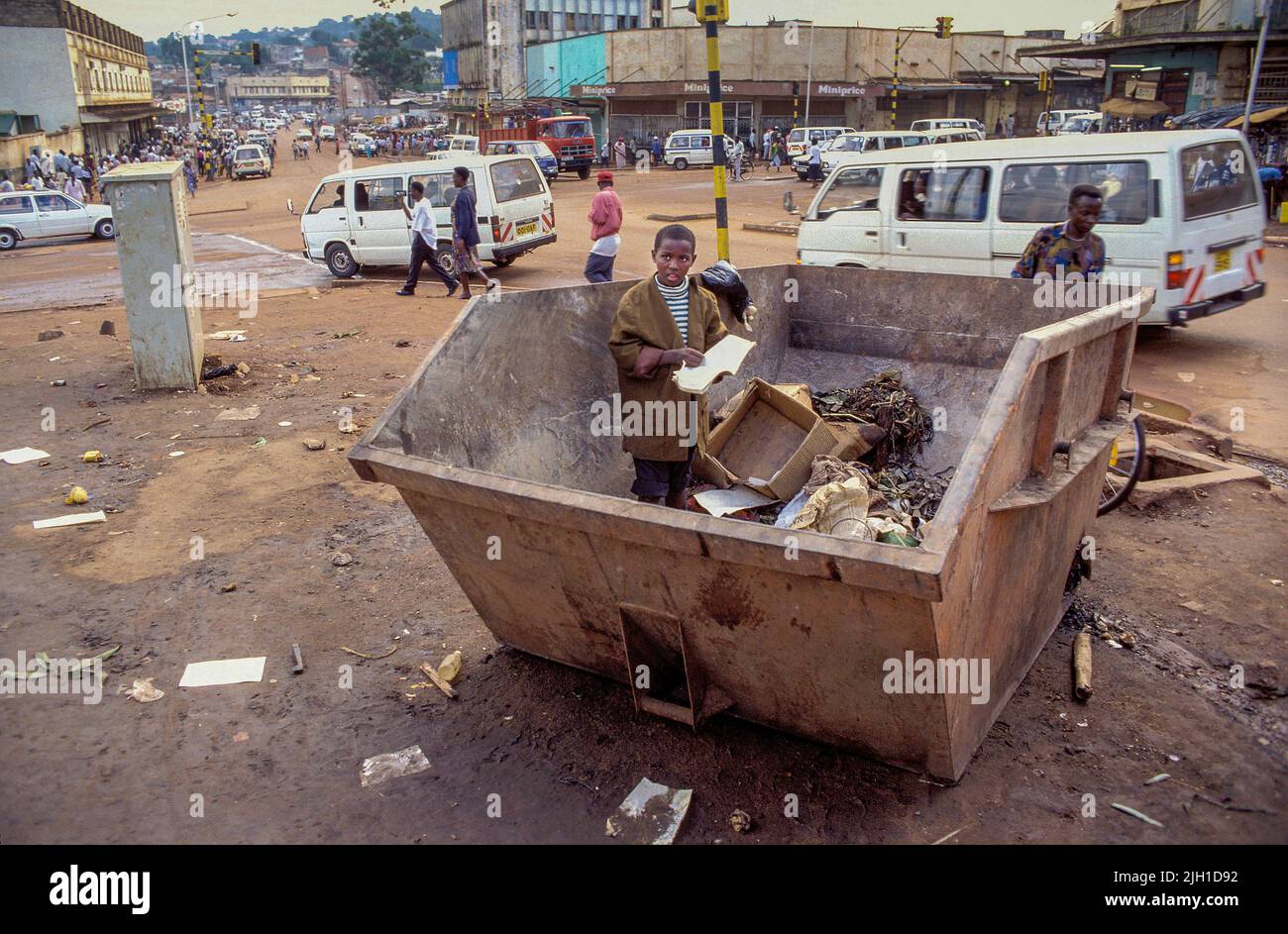 Uganda, Kampala; a street child in a trash container Stock Photo Alamy