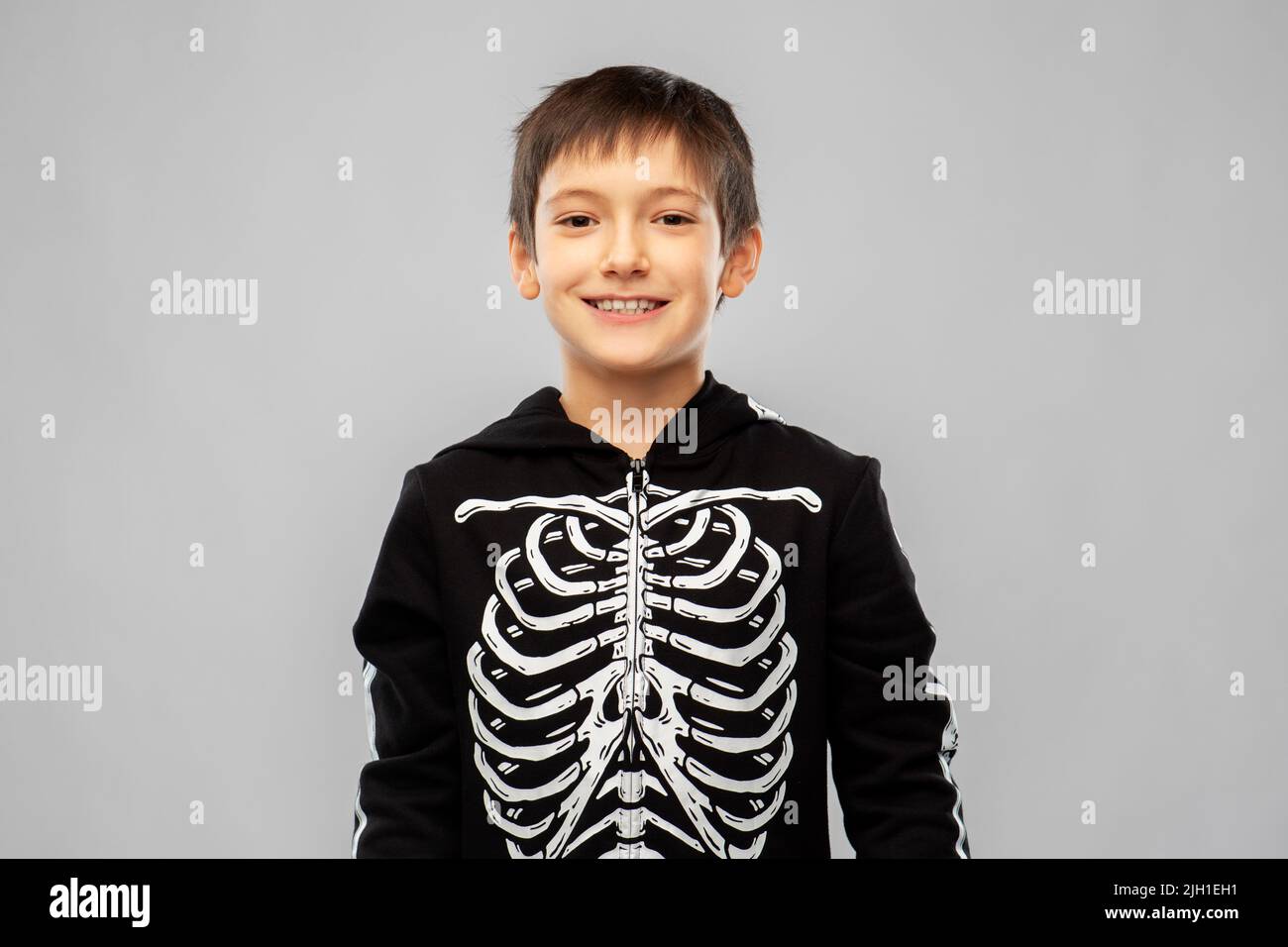 boy in black halloween costume with skeleton bones Stock Photo Alamy