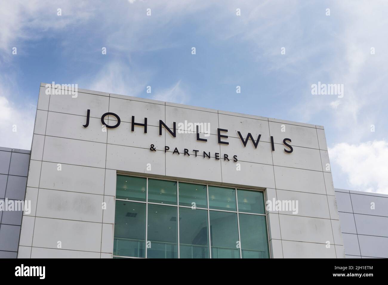 John Lewis & Partners sign on facade of building, The Mall, Cribbs Causeway, Bristol, UK Stock Photo