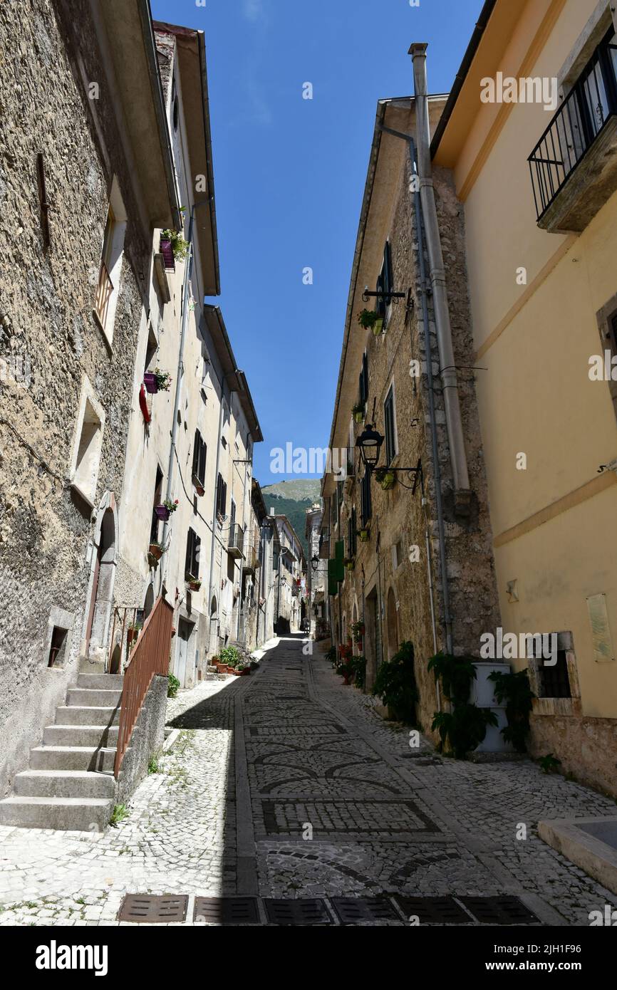 A narrow street surrounded by stony buildings in village San Donato Val di Comino Stock Photo
