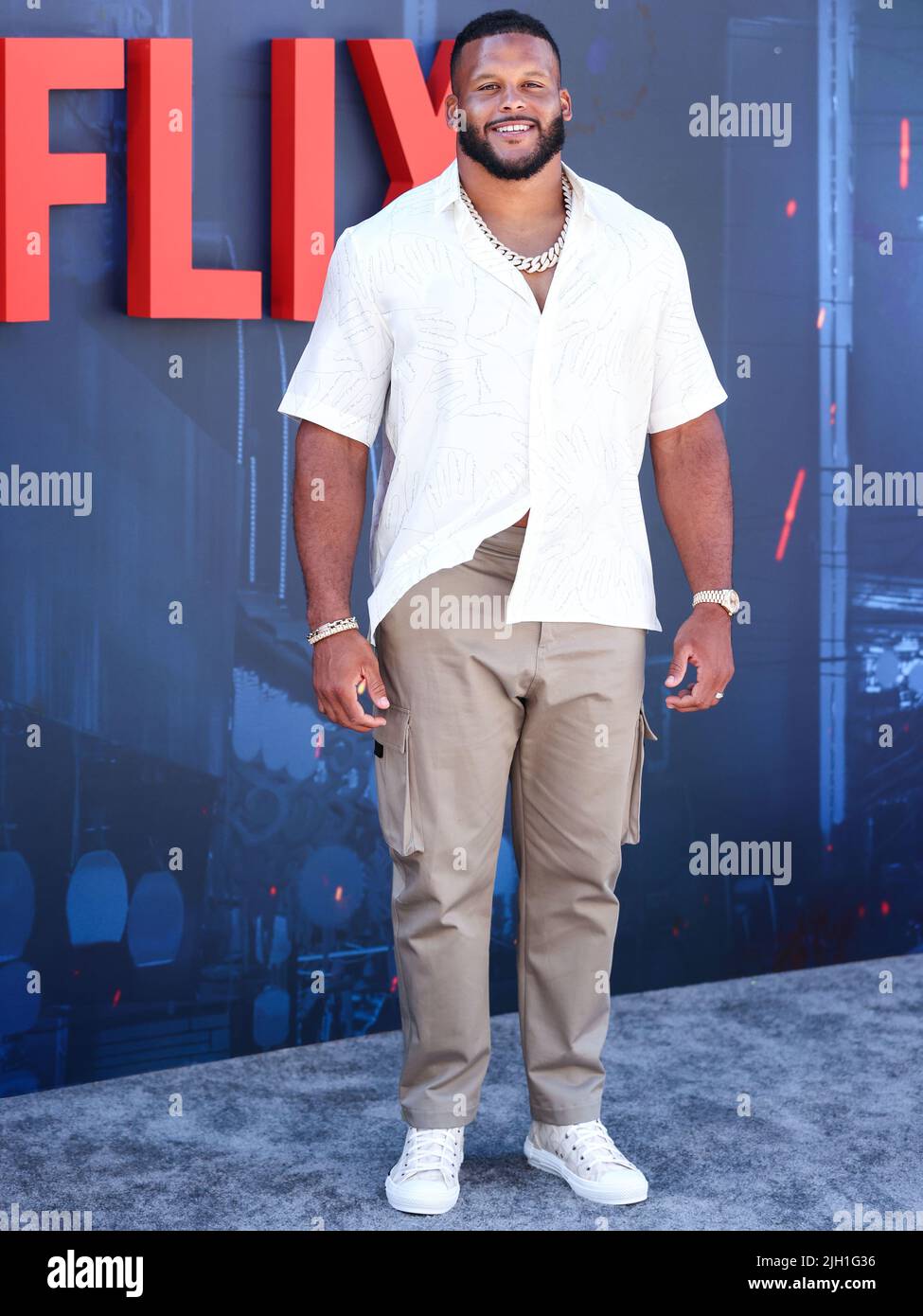 HOLLYWOOD, LOS ANGELES, CALIFORNIA, USA - JULY 13: American football defensive tackle player Aaron Donald arrives at the World Premiere Of Netflix's 'The Gray Man' held at the TCL Chinese Theatre IMAX on July 13, 2022 in Hollywood, Los Angeles, California, United States. (Photo by Xavier Collin/Image Press Agency) Stock Photo