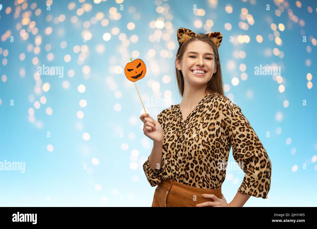 happy woman in halloween costume of leopard Stock Photo