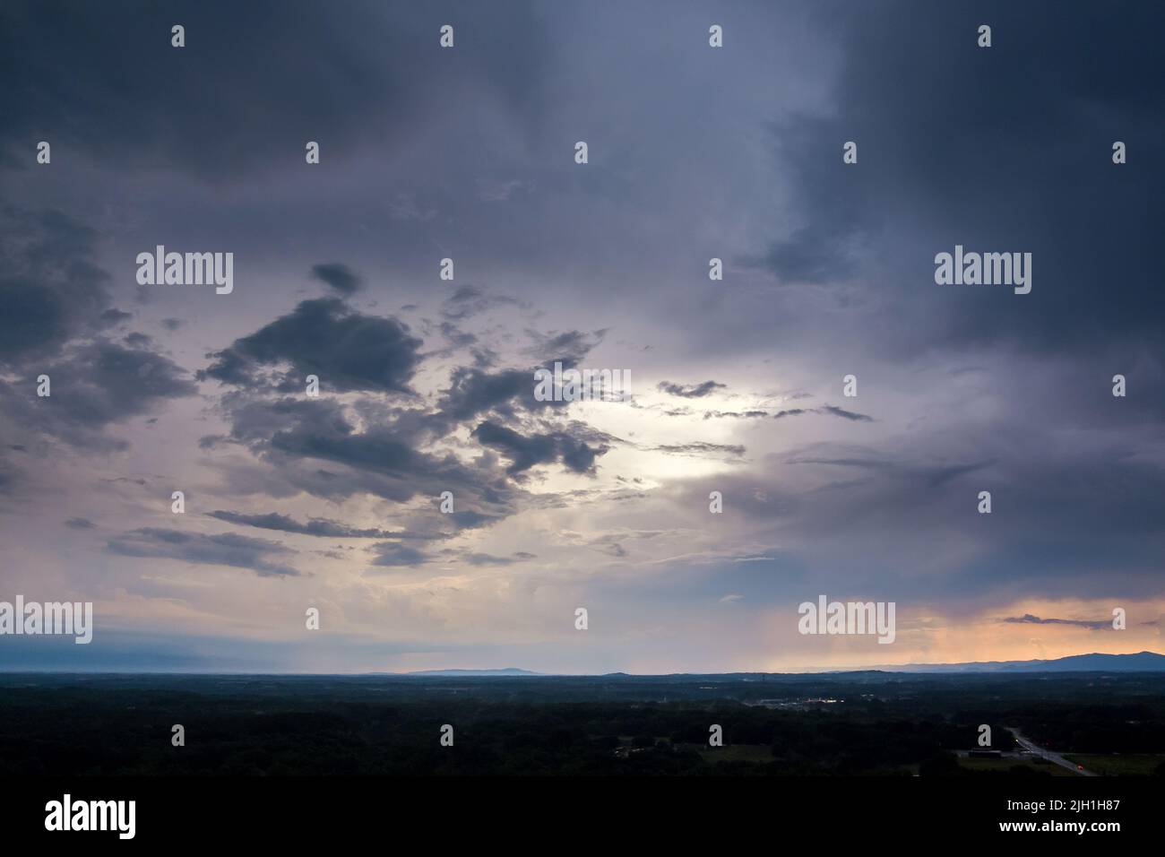 At sunset, storm clouds create a dramatic panorama Stock Photo - Alamy