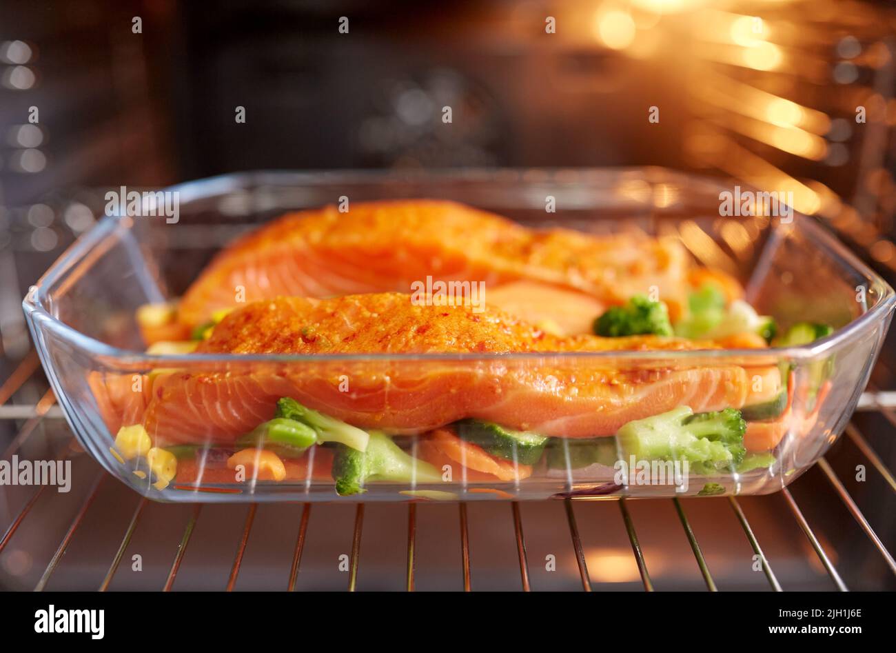 food cooking in baking dish in oven at home Stock Photo Alamy
