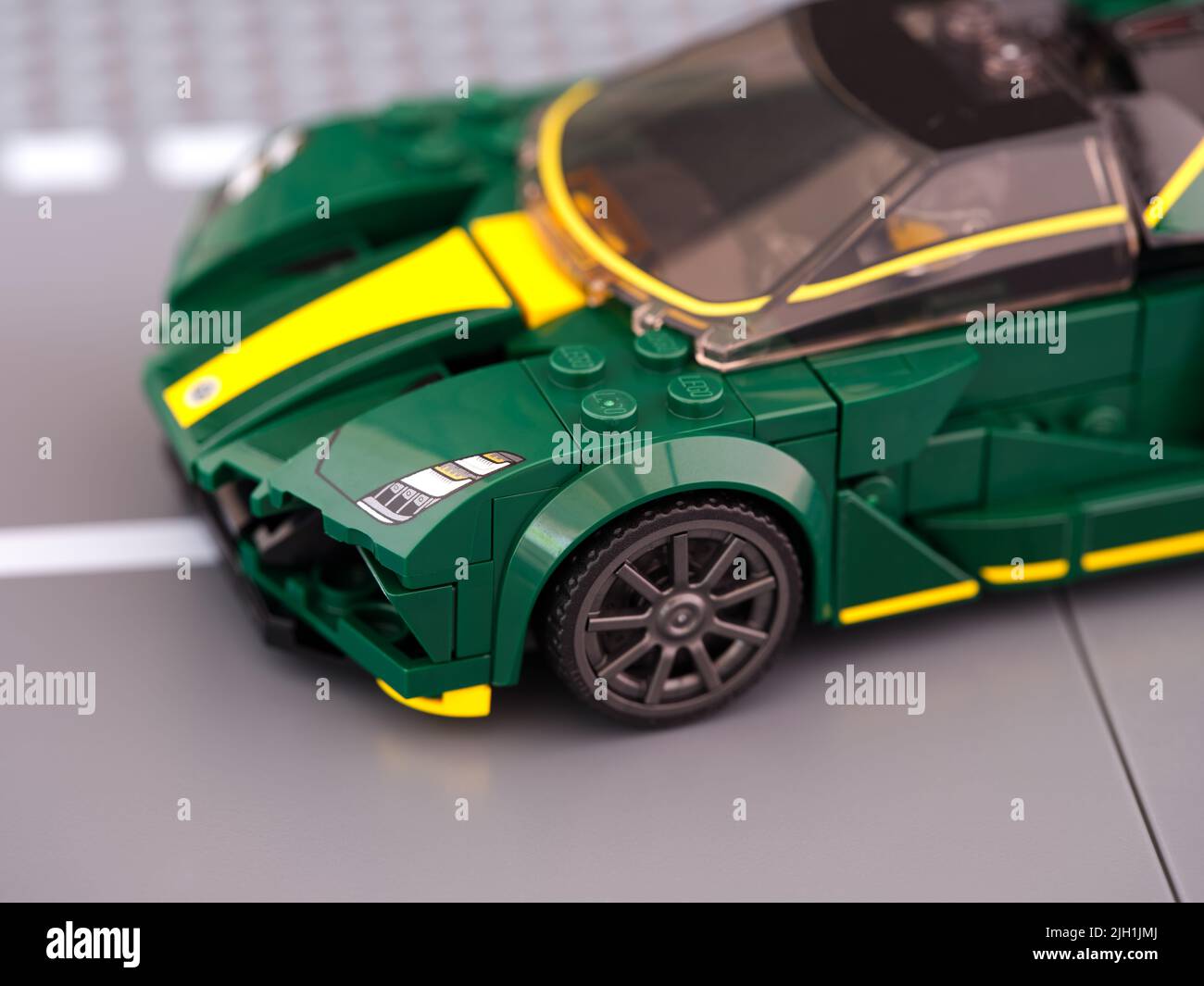 Tambov, Russian Federation - June 21, 2022 A close-up shot of a Lego Lotus Evija car on road baseplate. LEGO Speed Champions. Stock Photo