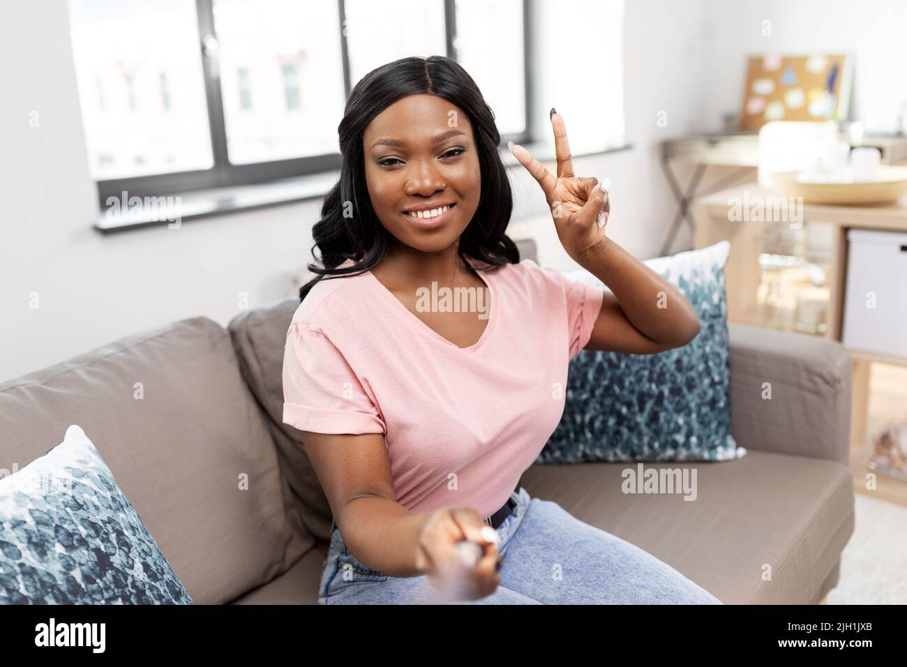 happy african american woman taking selfie at home Stock Photo - Alamy