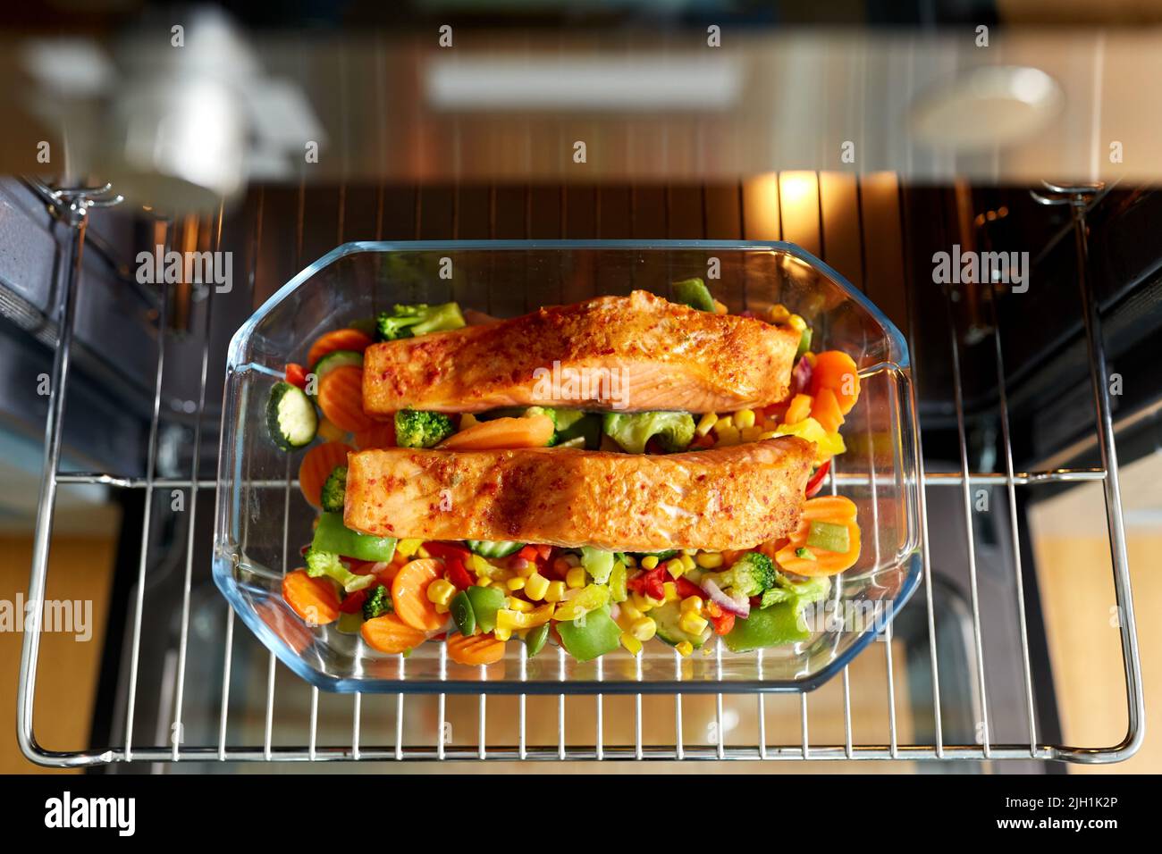 food cooking in baking dish in oven at home Stock Photo Alamy