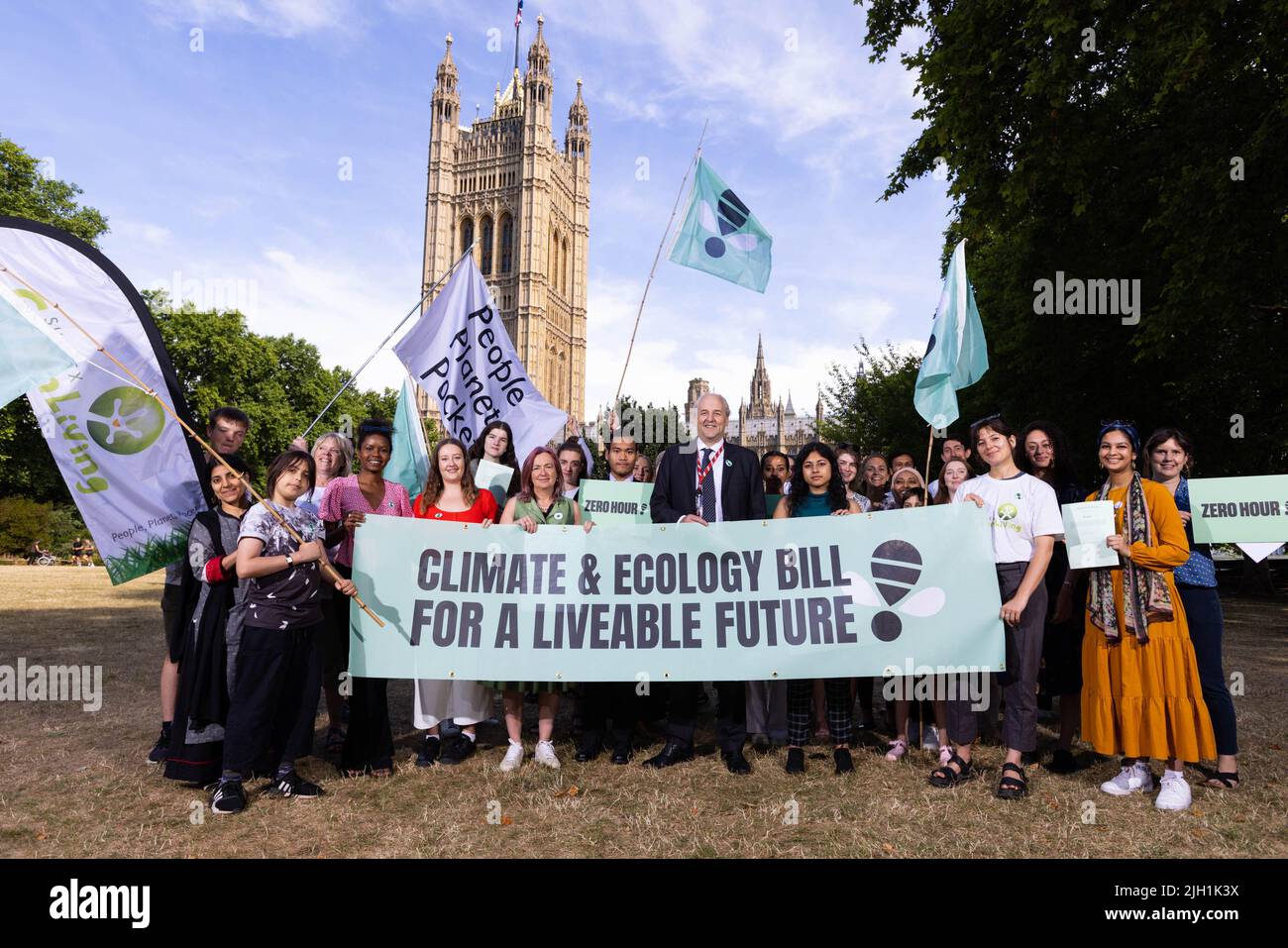EDITORIAL USE ONLY Lord Redesdale and Liz Saville Roberts MP join members of Zero Hour and various youth groups outside the Houses of Parliament ahead of handing in an open letter to all Members of the House of Lords asking Peers to back the Climate and Ecology Bill ahead of its second reading debate on 15 July 2022. Picture date: Thursday July 14, 2022. Stock Photo