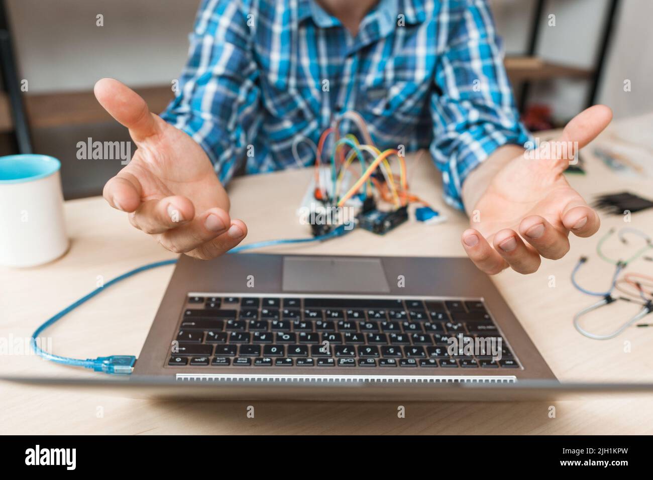Engineer hands raised up in desperate to laptop Stock Photo