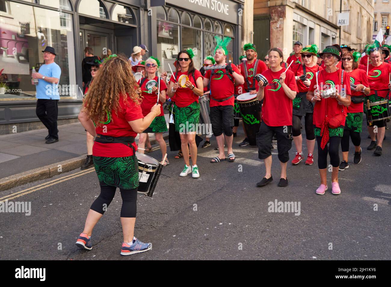 Drumming band performing at the annual carnival as it progresses through the streets of the historic city of Bath in Somerset. Stock Photo
