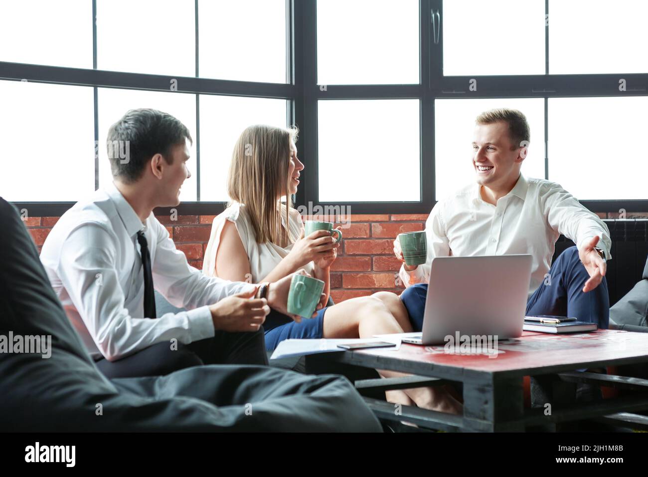 A Group of young friends having fun in an informal atmosphere. Stock Photo