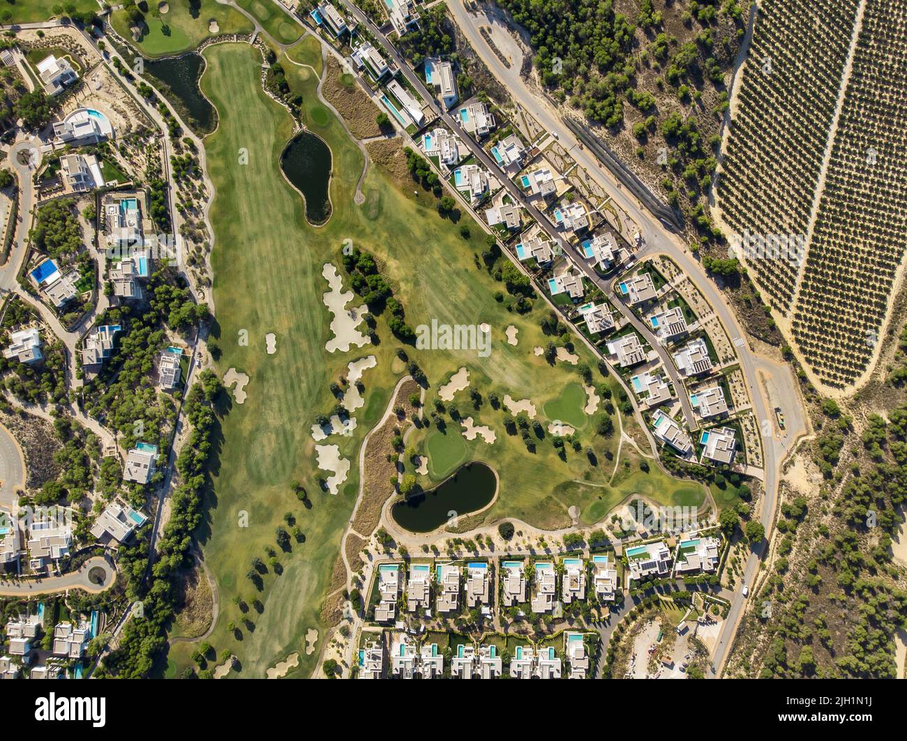 An aerial view of Spanish Las Colinas golf course with modern luxury villas and surrounding