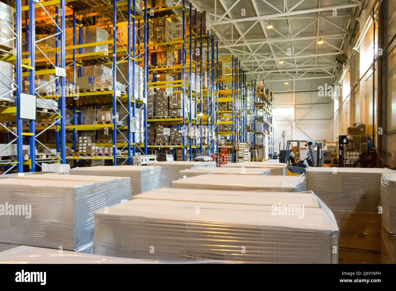 Group of boxes in storehouse. Pallets with carton boxes. Interior of a