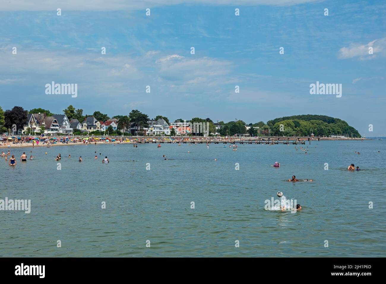 Beach, people in the sea, houses at the seafront, Travemünde, Lübeck, Schleswig-Holstein, Germany Stock Photo