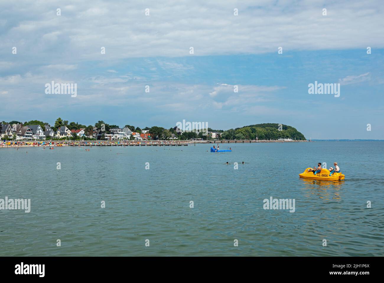 Beach, pedal boat, houses at the seafront, Travemünde, Lübeck, Schleswig-Holstein, Germany Stock Photo