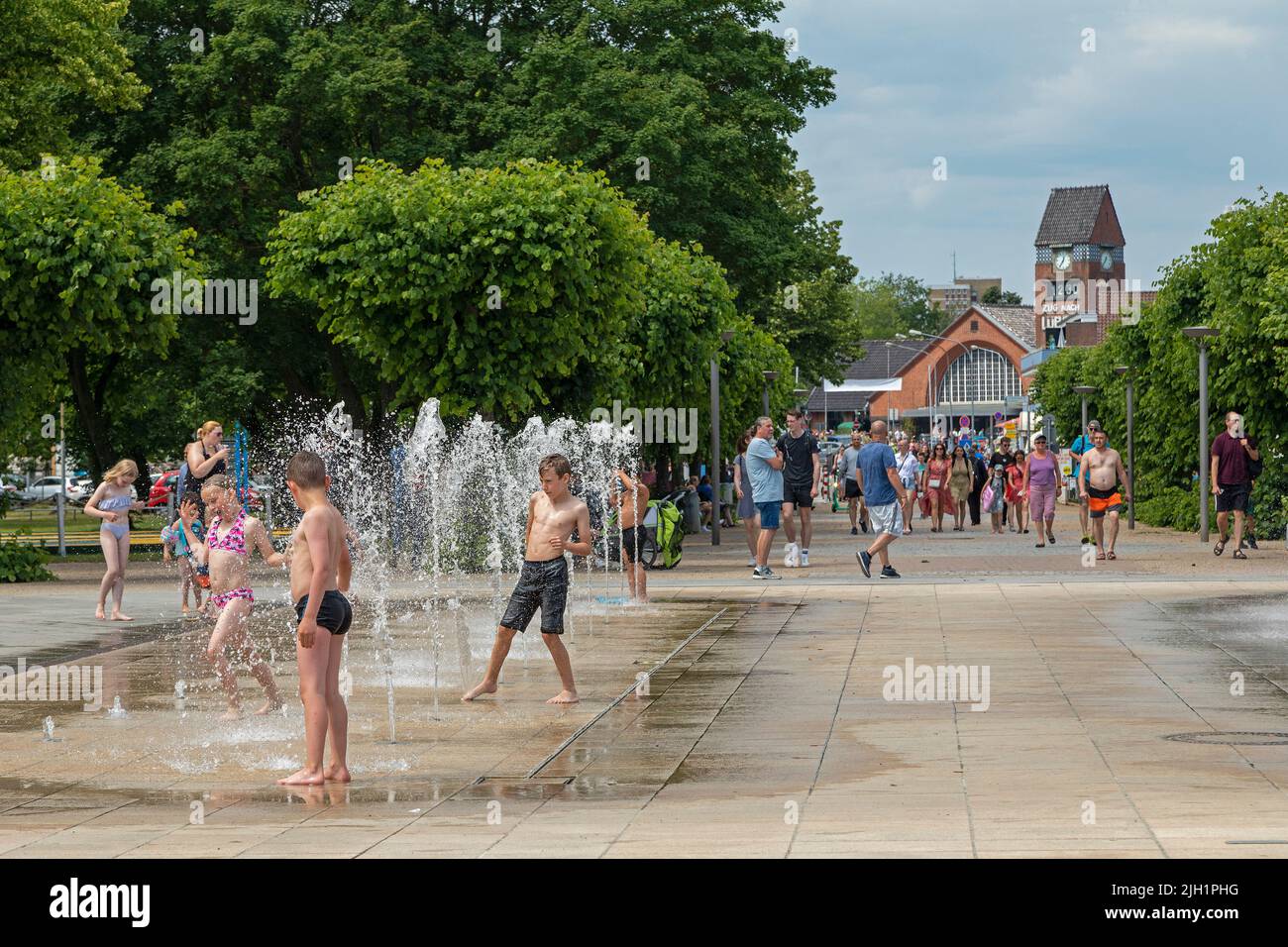 People, children, water game, train station, Travemünde, Lübeck, Schleswig-Holstein, Germany Stock Photo