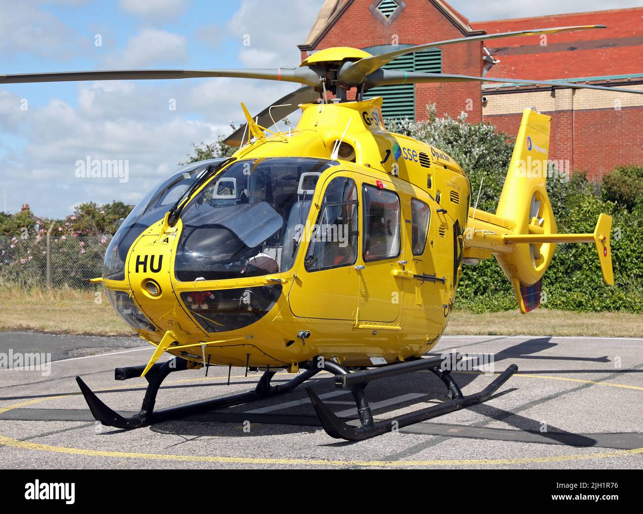 Aerial view of an SSE Helicopter parked on the apron at Blackpool Airport, Lancashire. Call sign G-SPHU. Owned by Babcock International. Stock Photo