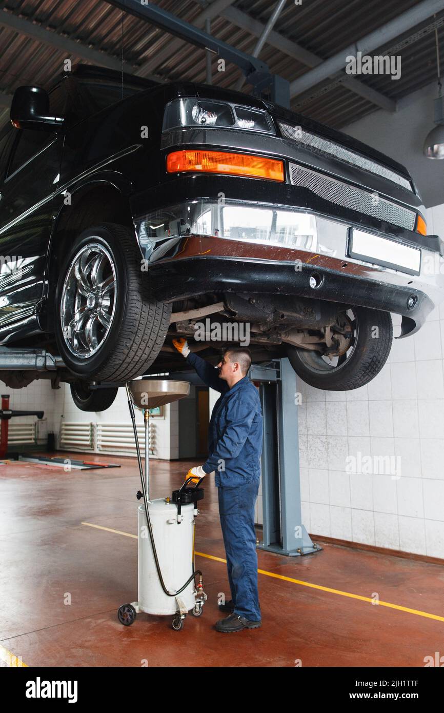 Change engine oil and transmission inspection Stock Photo Alamy