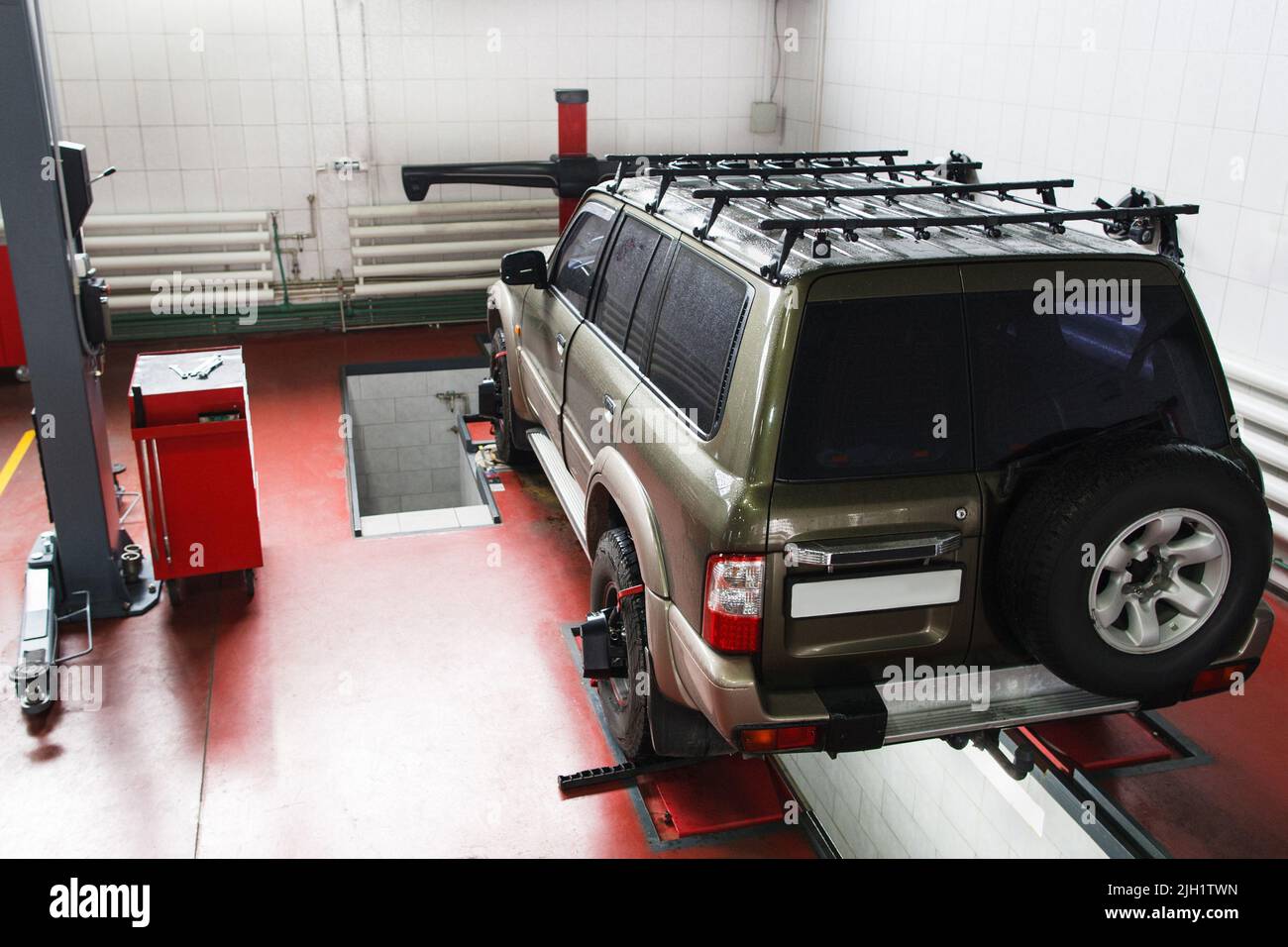 SUV on scheduled scanning at auto service Stock Photo