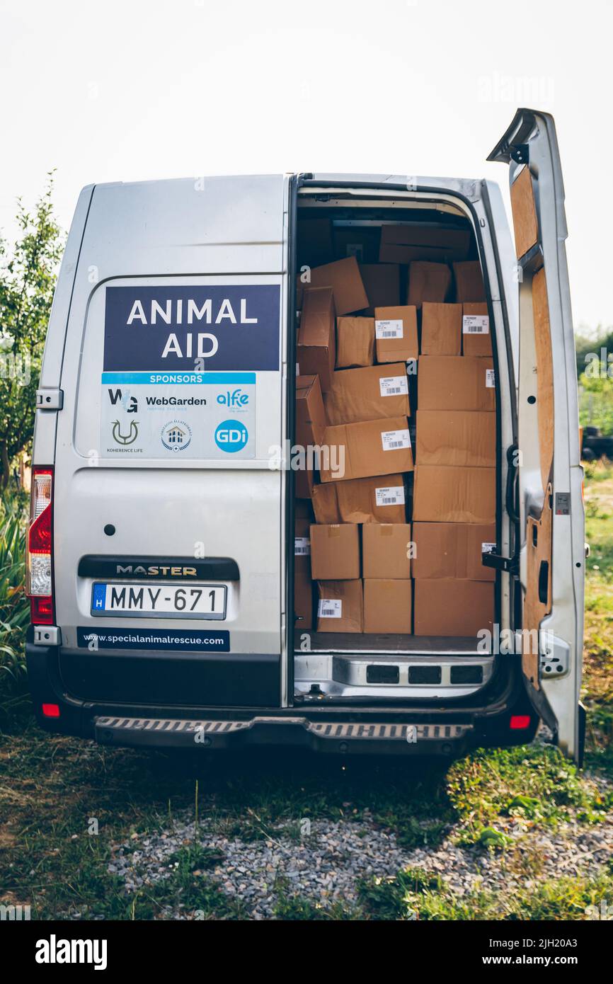 Cargo with pets food, humanitarian aid for animals from Europe for volunteers in Ukraine who take care of animal rescue. Volunteers help Ukrainian pet Stock Photo