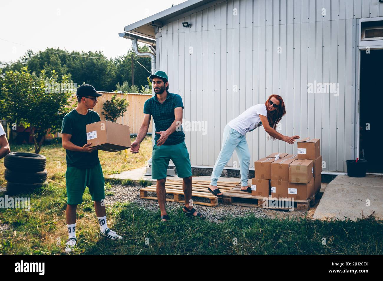 Volunteers unload pets food aid for animals from Europe for volunteers